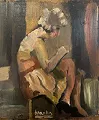 Femme assise à la lecture 